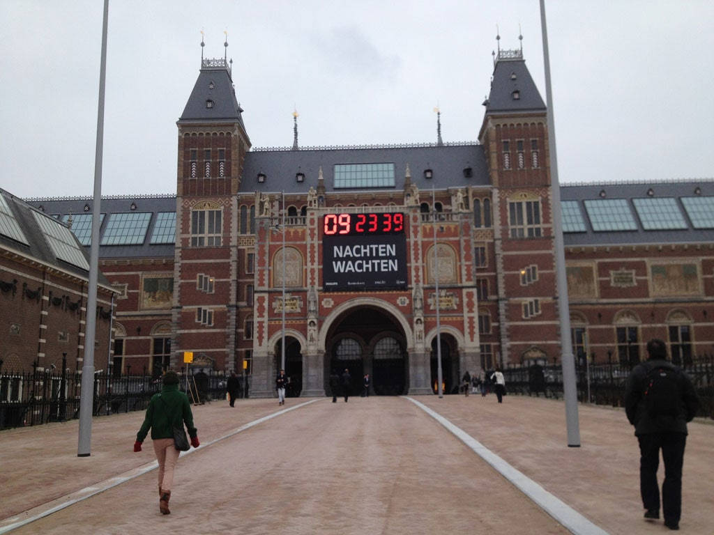 People Walking Towards Rijksmuseum Entrance Background