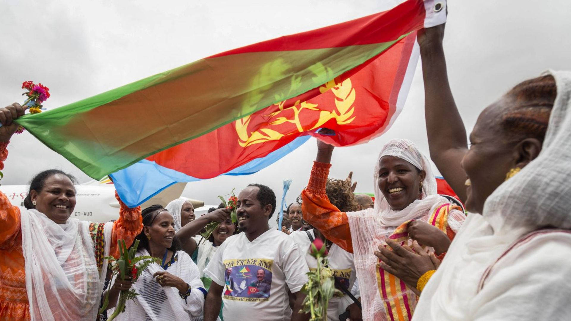 People Waving Eritrea Flag Background