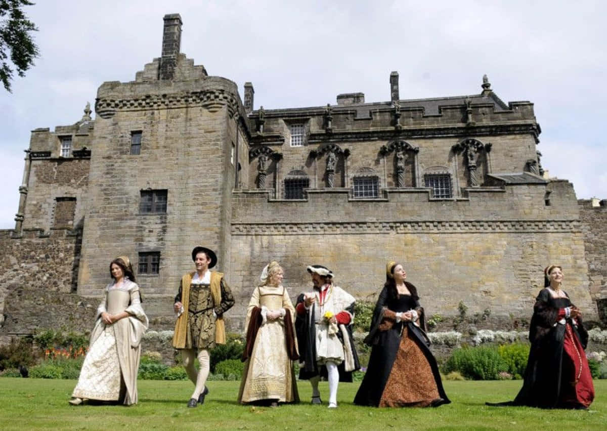 People Wearing Traditional Clothes At Sterling Castle Wallpaper