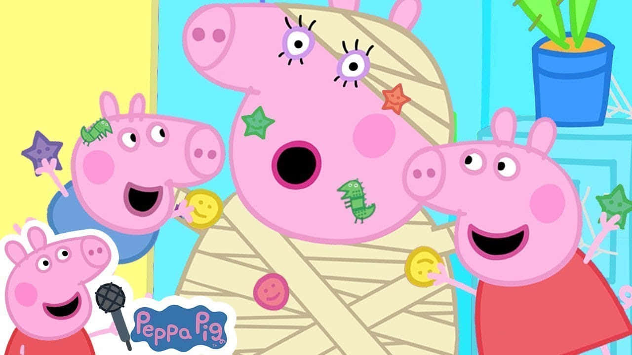 Peppa, George, and Mummy Pig all having a great time at the beach.