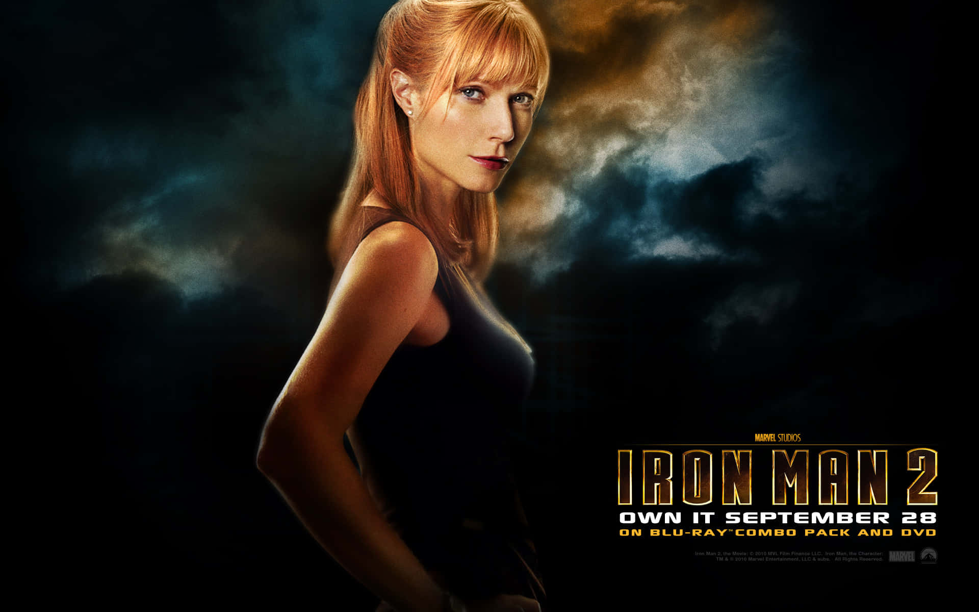 Pepper Potts in action with Iron Man armor Wallpaper
