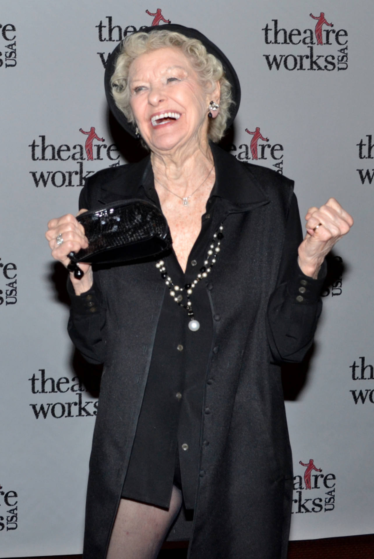 Elaine Stritch strikes a happy pose in an elegant black outfit. Wallpaper