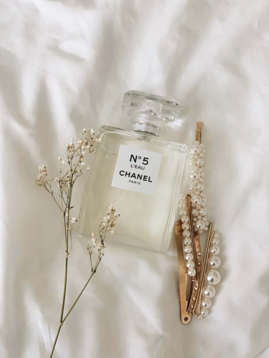 Chanel Perfume, Pearls, And Hair Clips