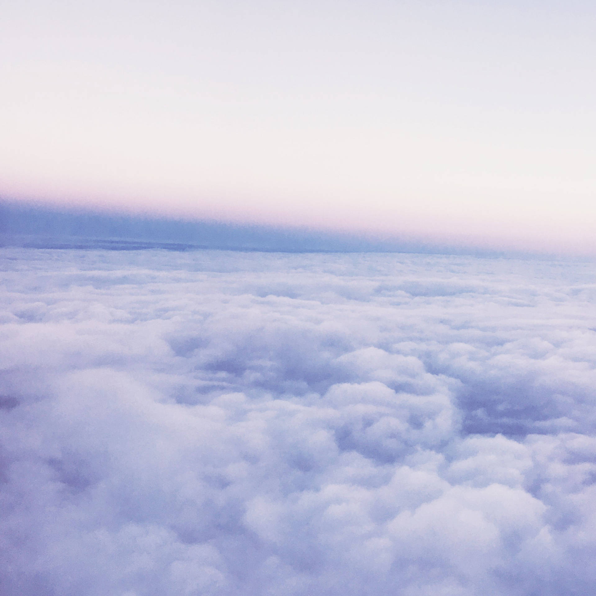 Periwinkle Sky Above Clouds Wallpaper