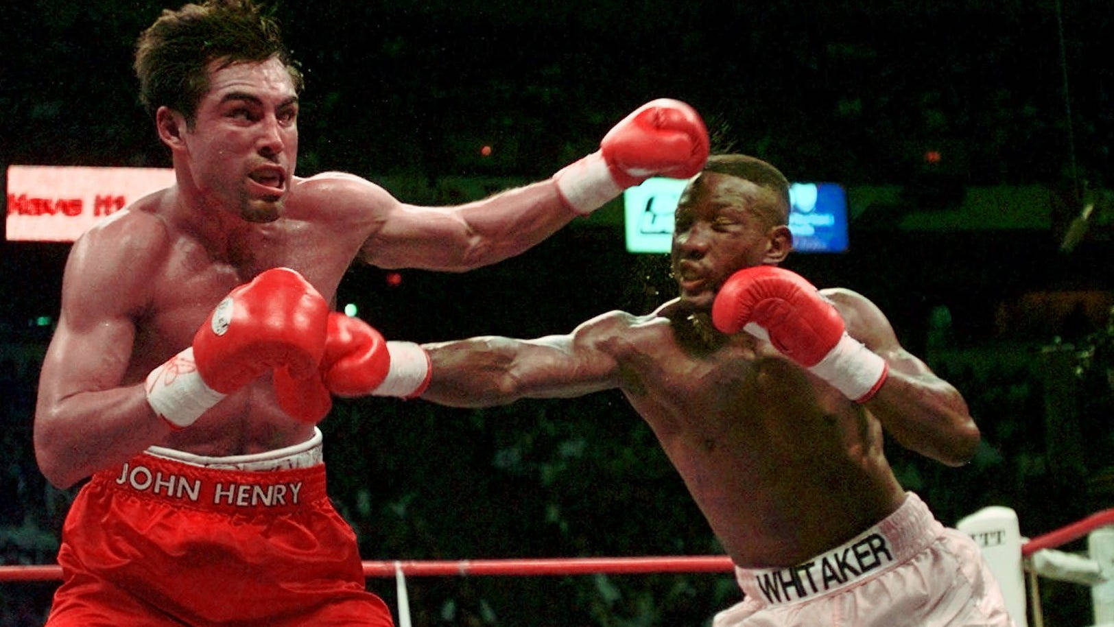 Caption: Pernell Whitaker Masterfully Dodging a Punch in the Ring Wallpaper