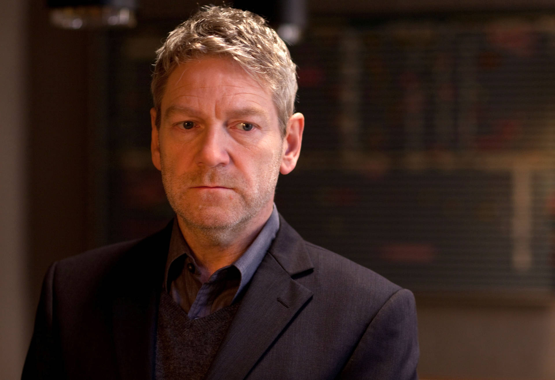 Versatile actor Kenneth Branagh in deep thought Wallpaper