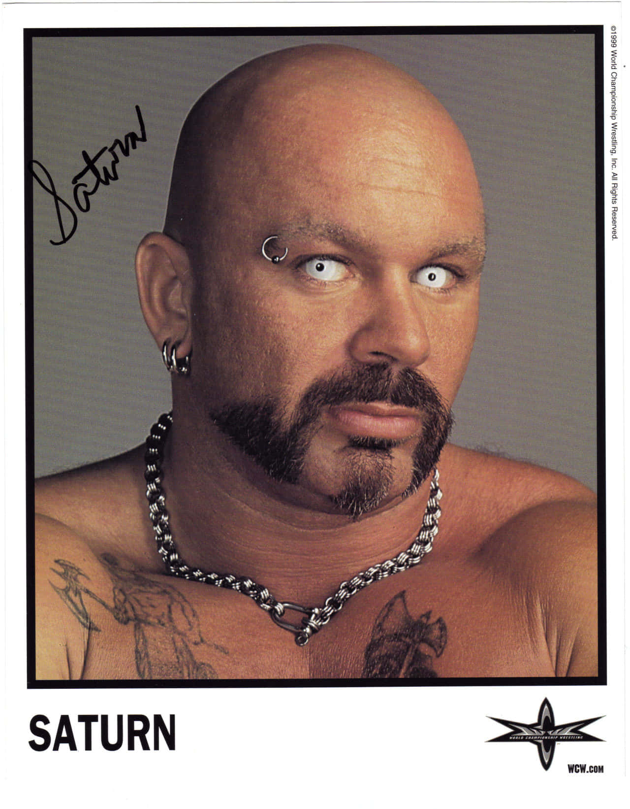 Perry Saturn posing in a signed poster Wallpaper
