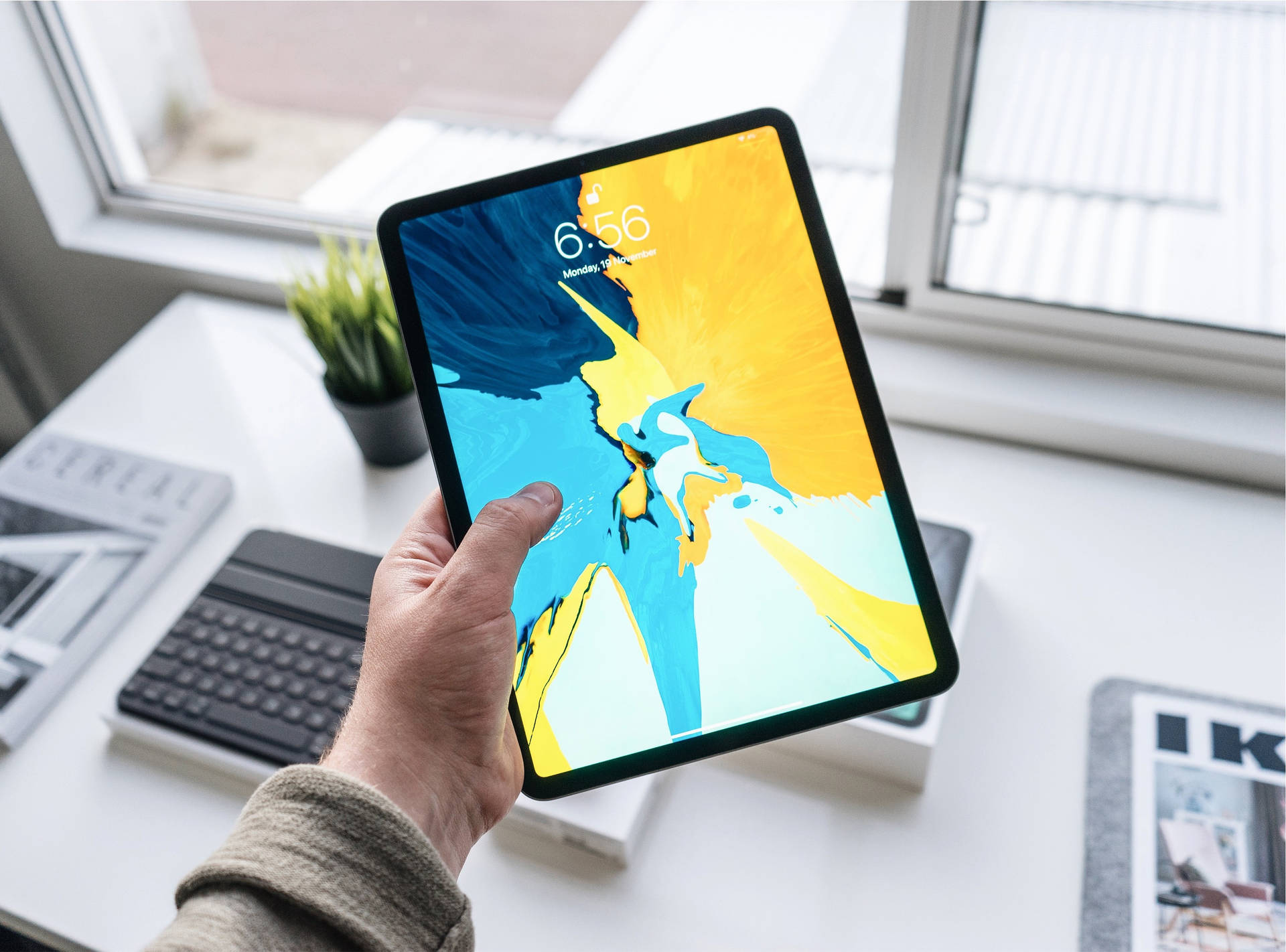Person Holding Apple Ipad Pro Picture