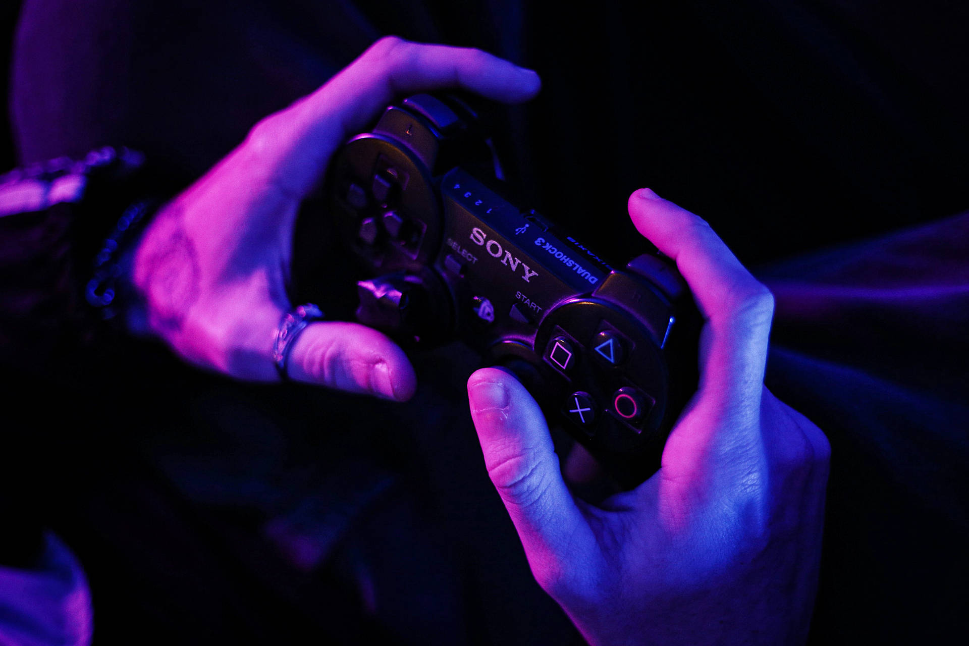 Person Holding Ps3 Controller Wallpaper