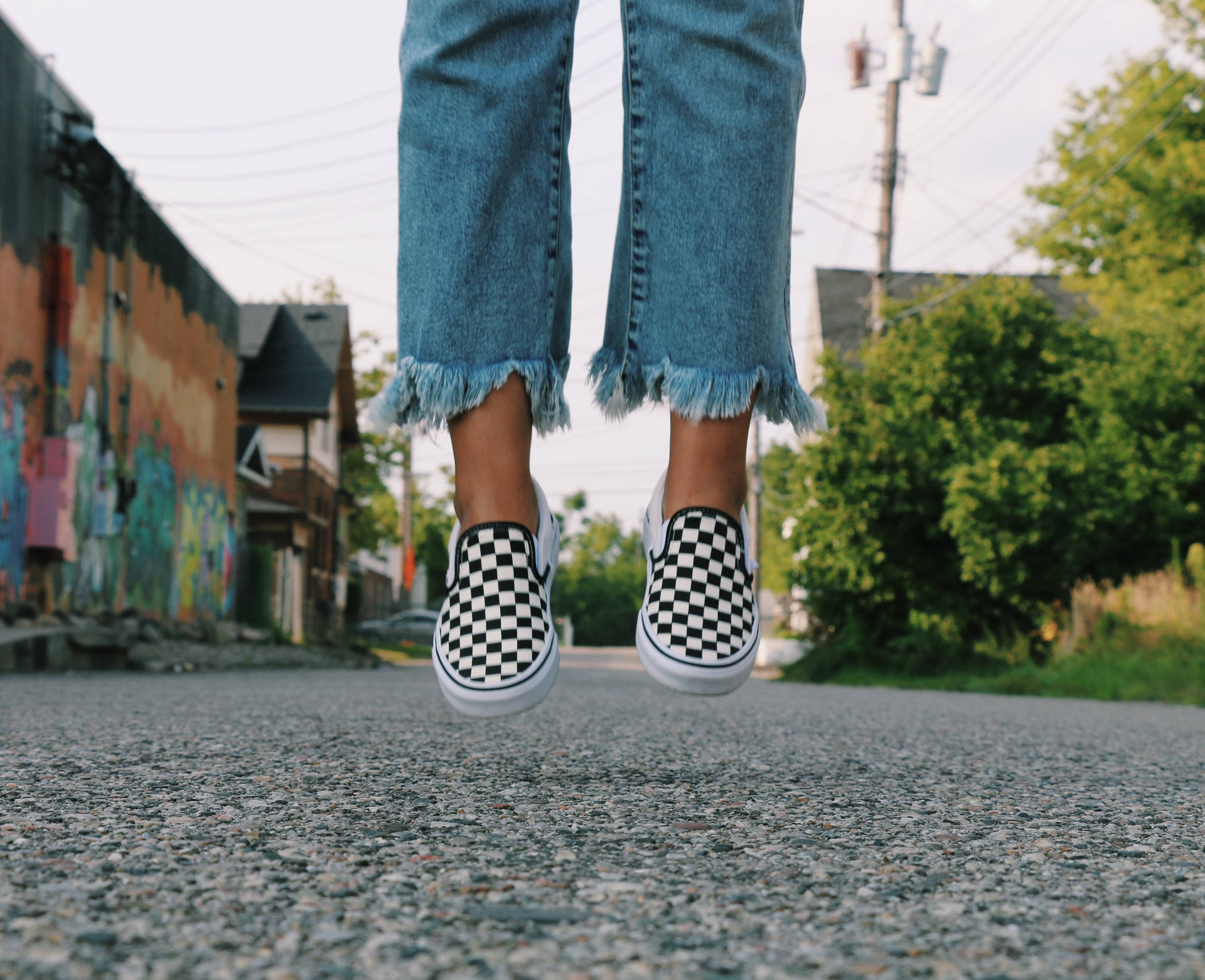 Person In Vans Checkered Shoes Wallpaper
