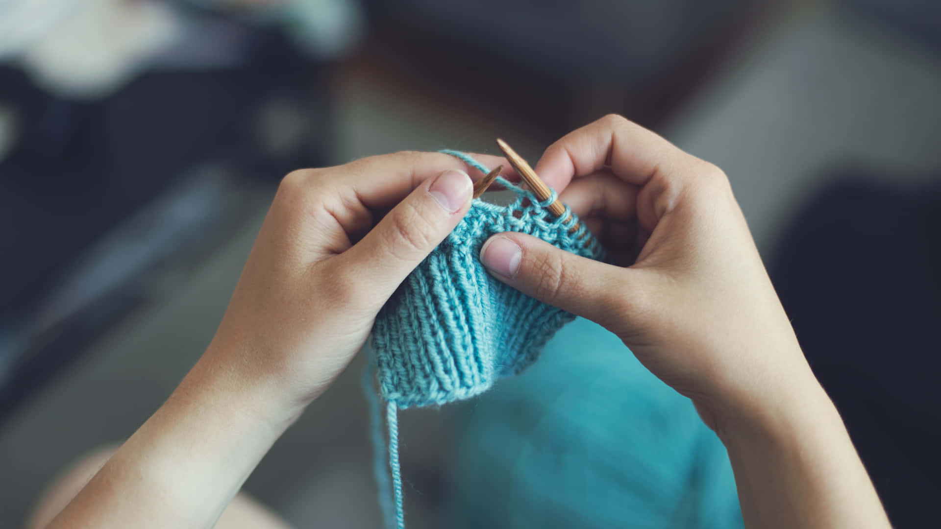 Person's Hands Knitting Blue Wool Yarn Wallpaper