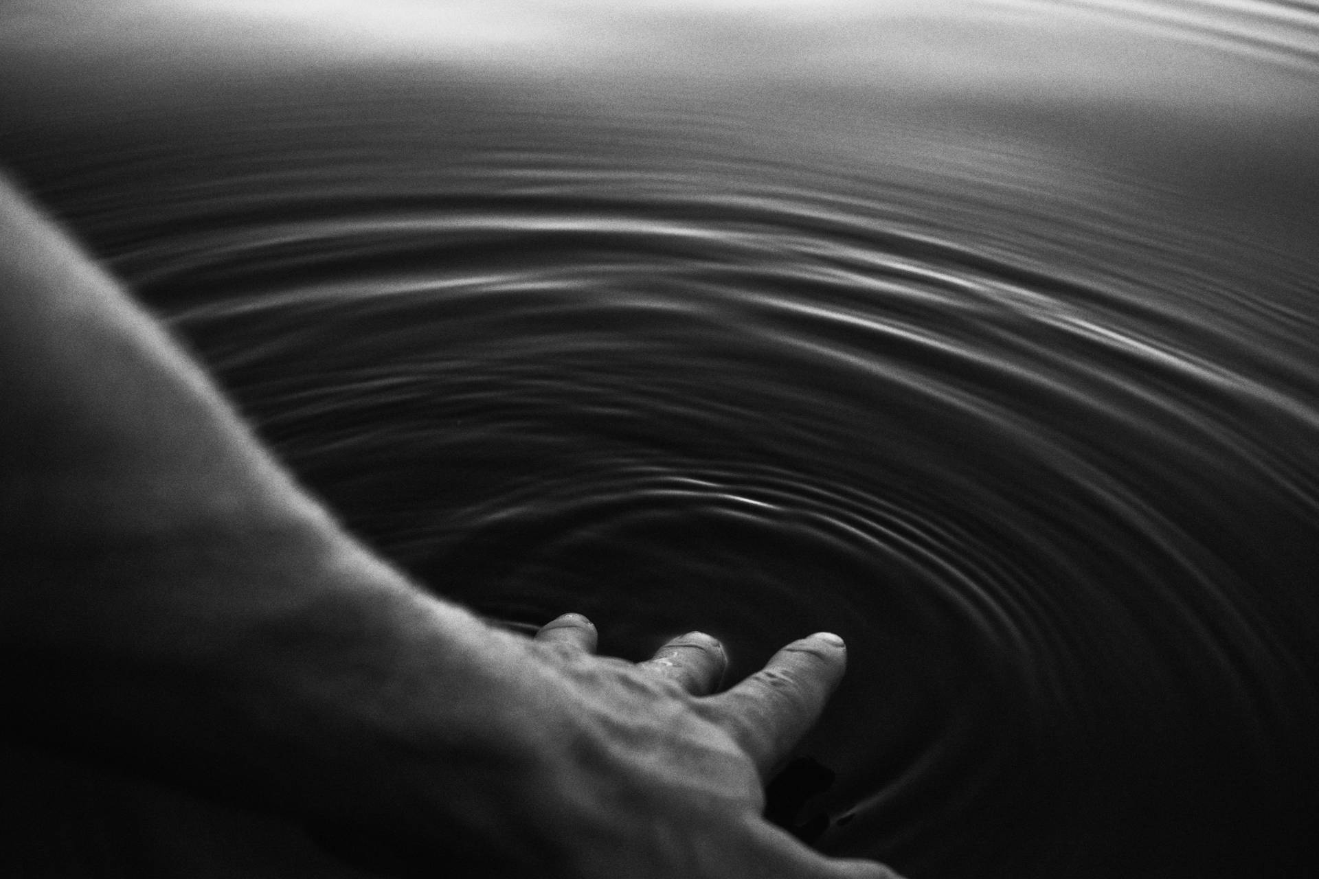 Person Touching Water Black Screen 4k Wallpaper