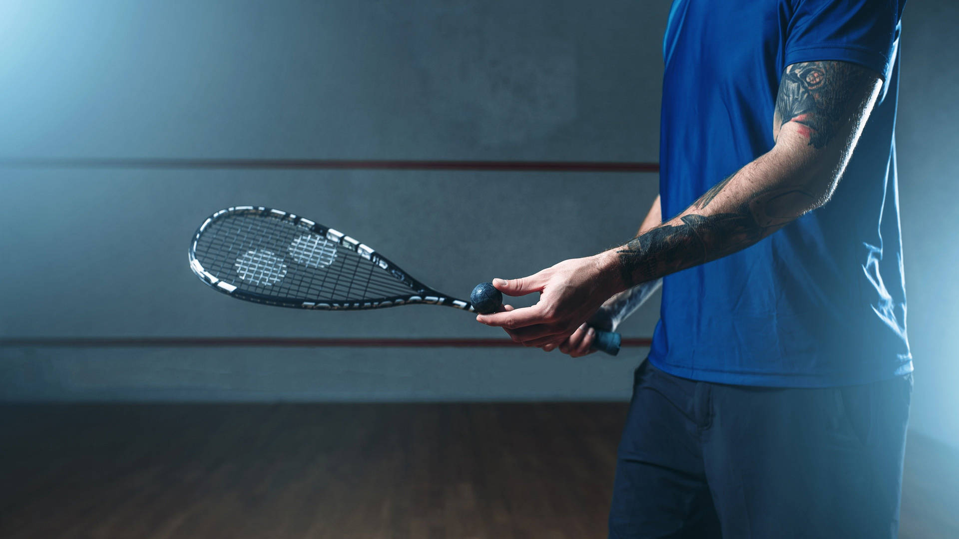 Person With Black Squash Racket Background
