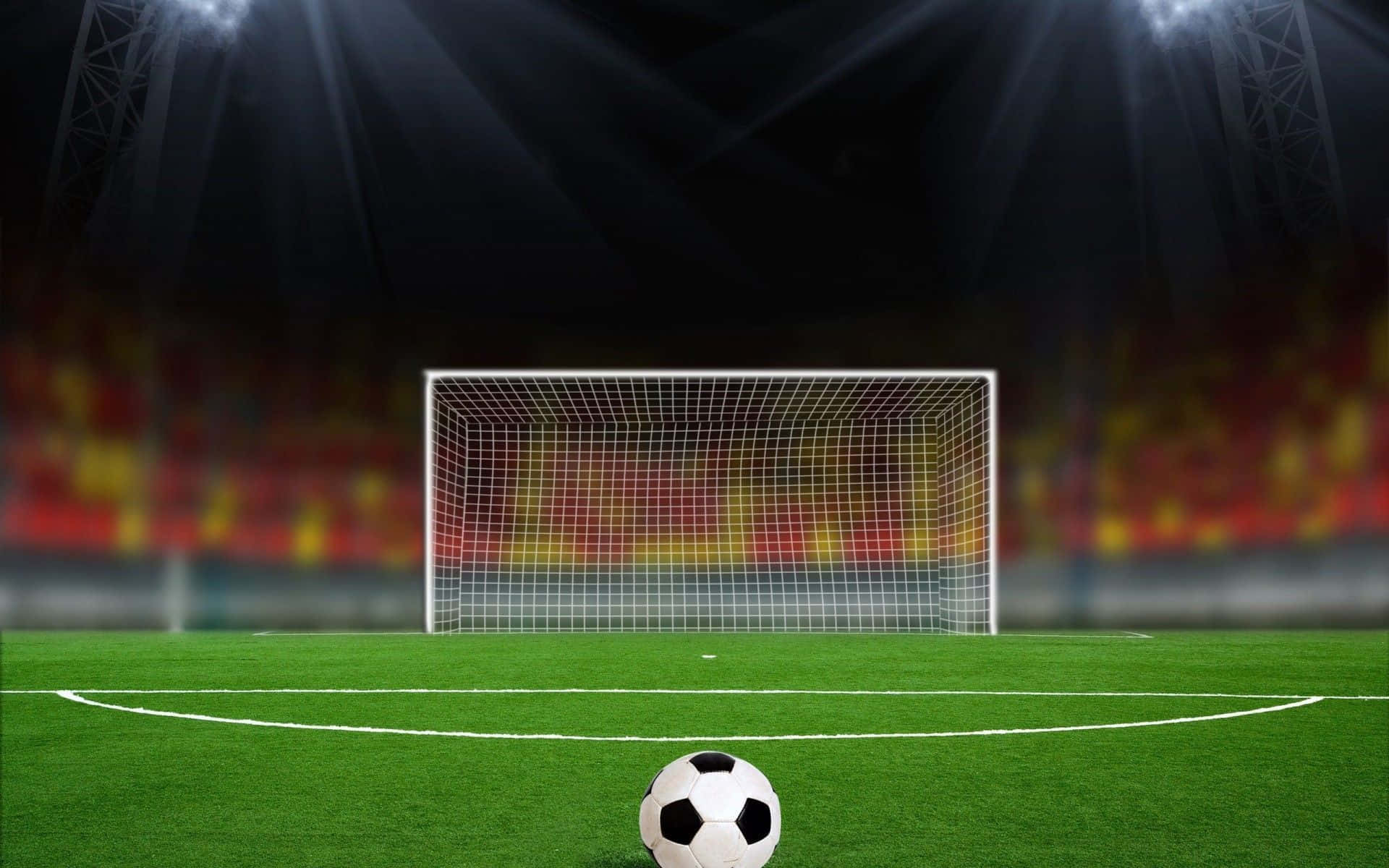 Perspective Of Soccer Ball In Football Field Wallpaper