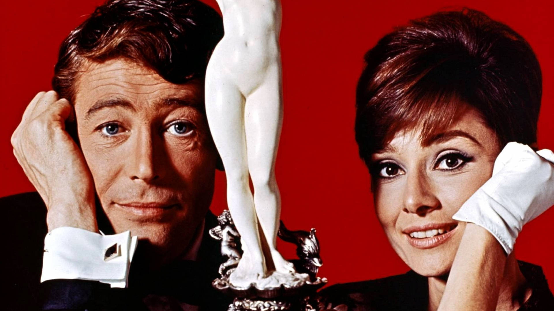 Peter O'Toole og Audrey Hepburn skinner på baggrunden. Wallpaper