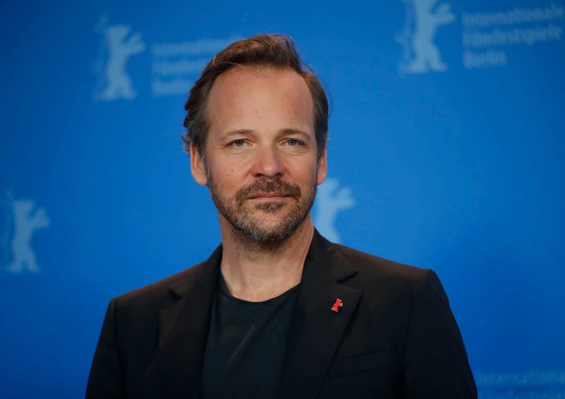 Actor Peter Sarsgaard strikes a thoughtful pose Wallpaper