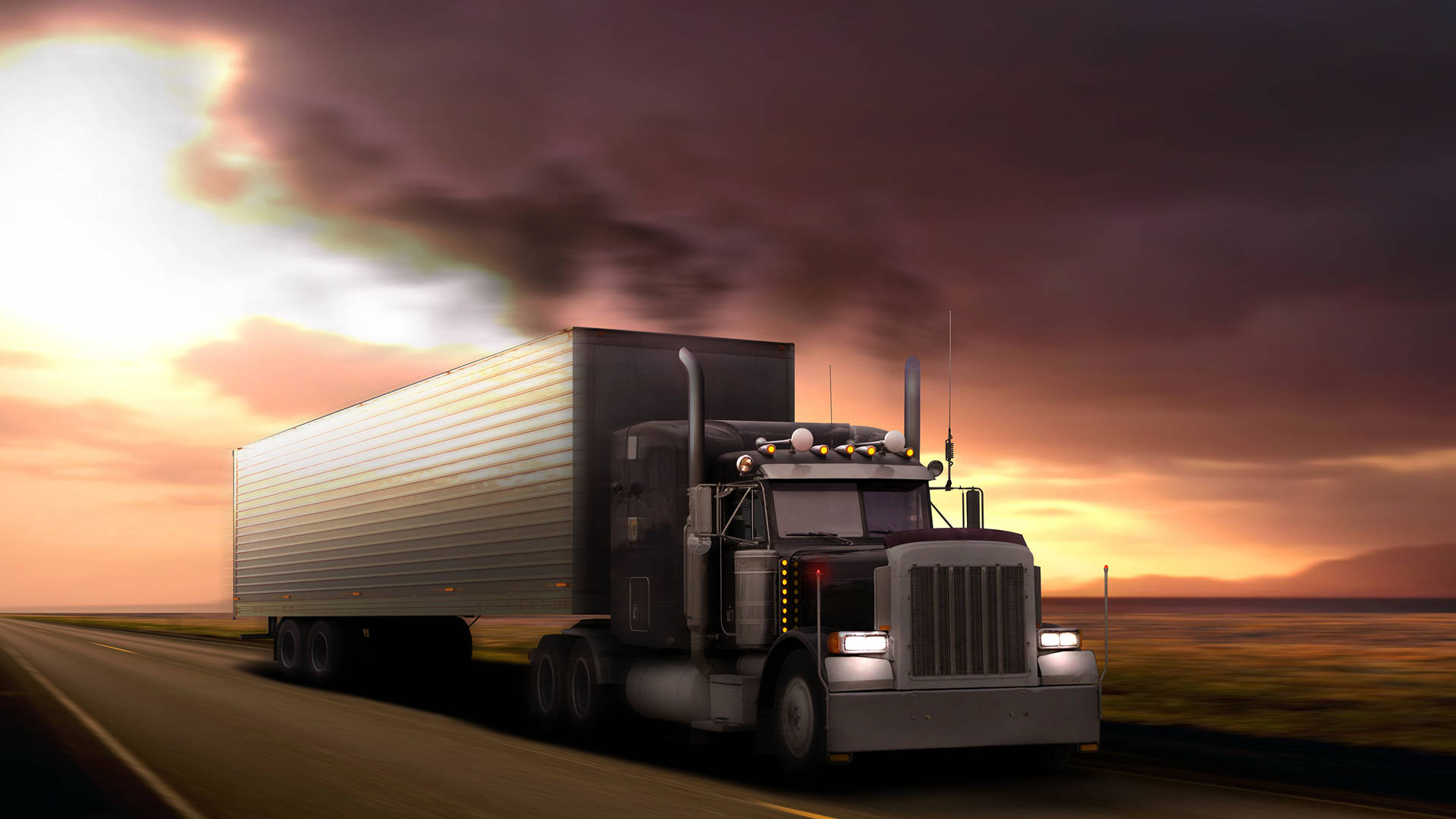 A Large Truck Driving Down A Road Wallpaper