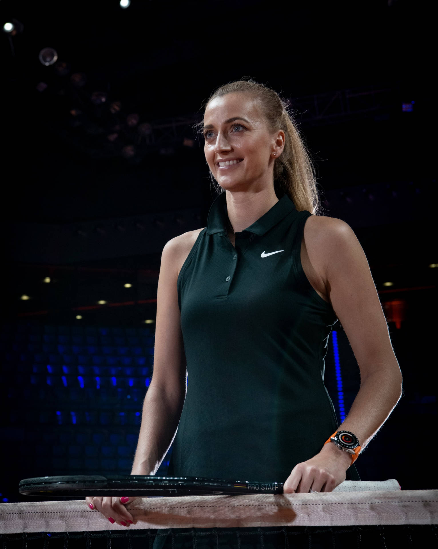 Petra Kvitova Smiling and Radiating Positivity in a Standing Pose Wallpaper