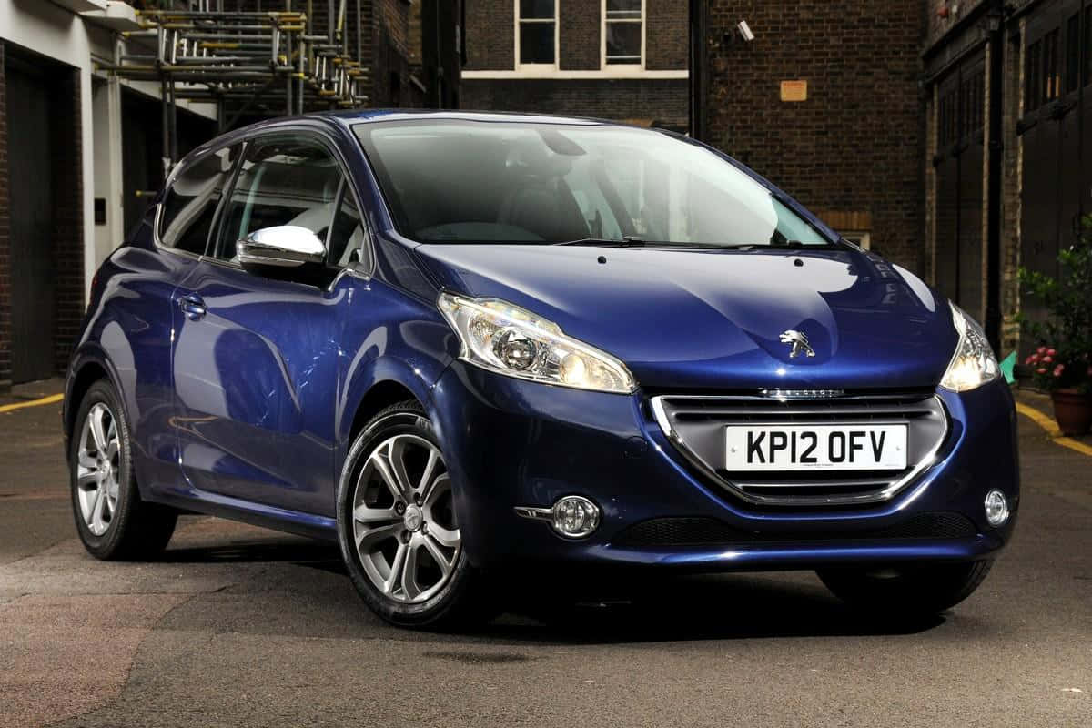 Stunning Peugeot 208 in Blue: Compact Car with a Stylish Design Wallpaper