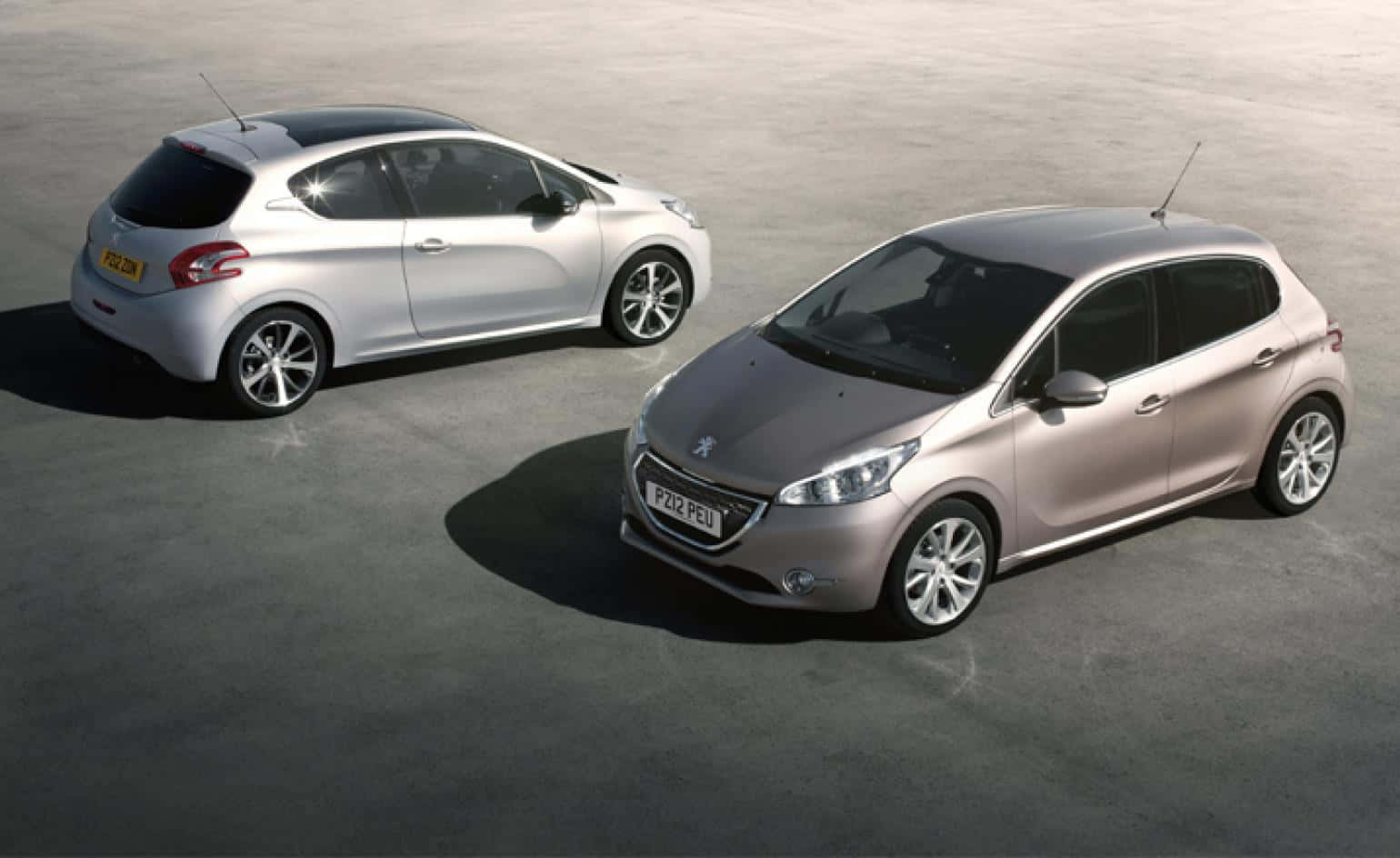Sleek and Stylish Peugeot 208 in Action Wallpaper