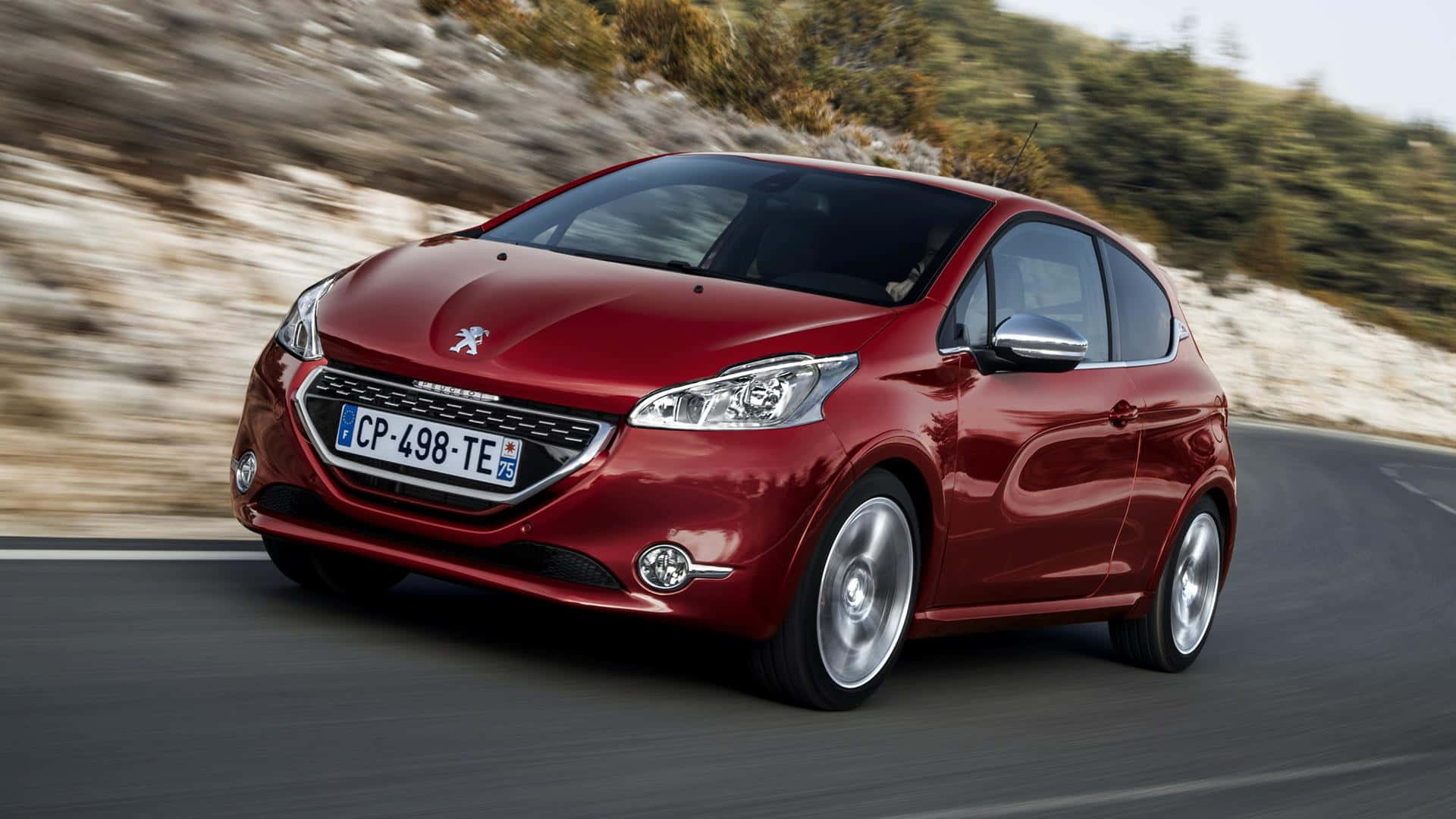 Sleek and Stylish Peugeot 208 in a Stunning Urban Environment Wallpaper