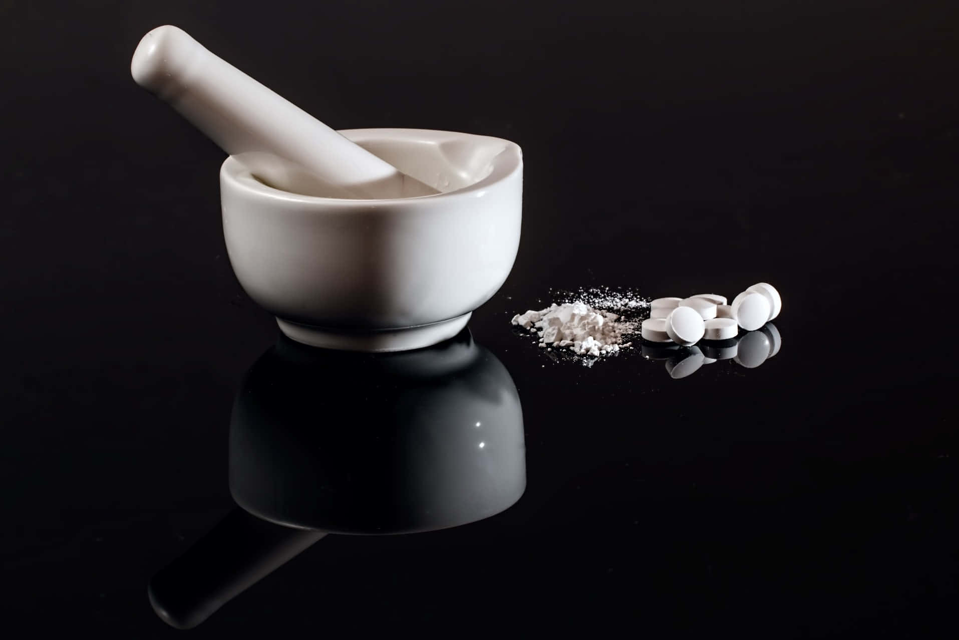 A Mortar And Pestle With Some Pills