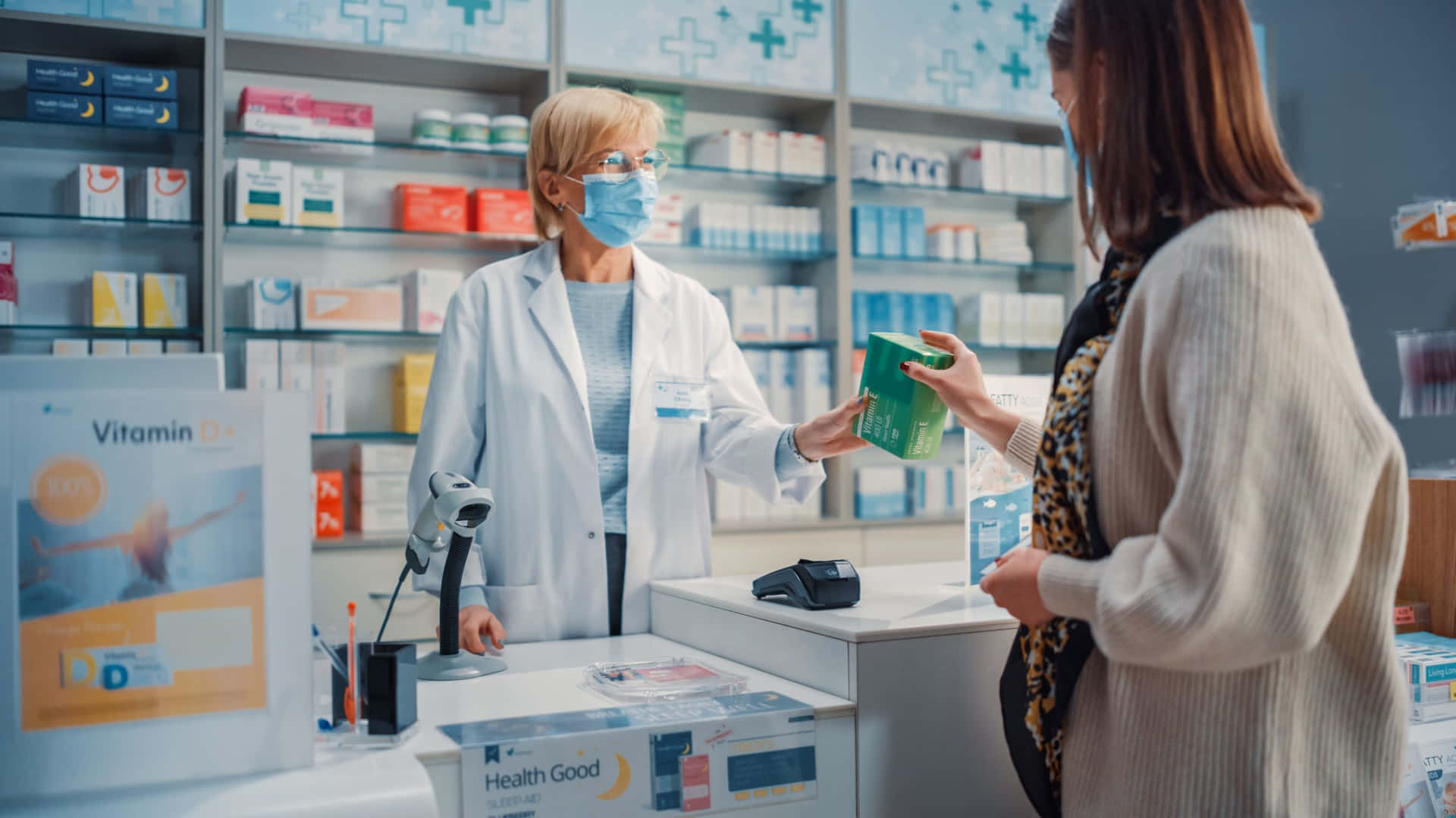 Two Women In A Pharmacy Talking To Each Other