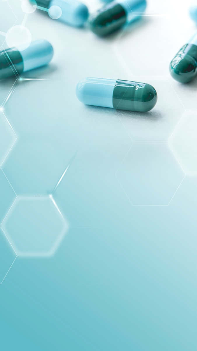 A Group Of Pills On A Blue Background