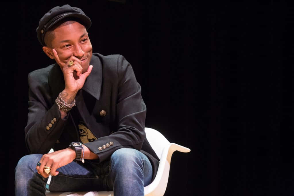 Pharrell Williams Smiling During Event.jpg Wallpaper