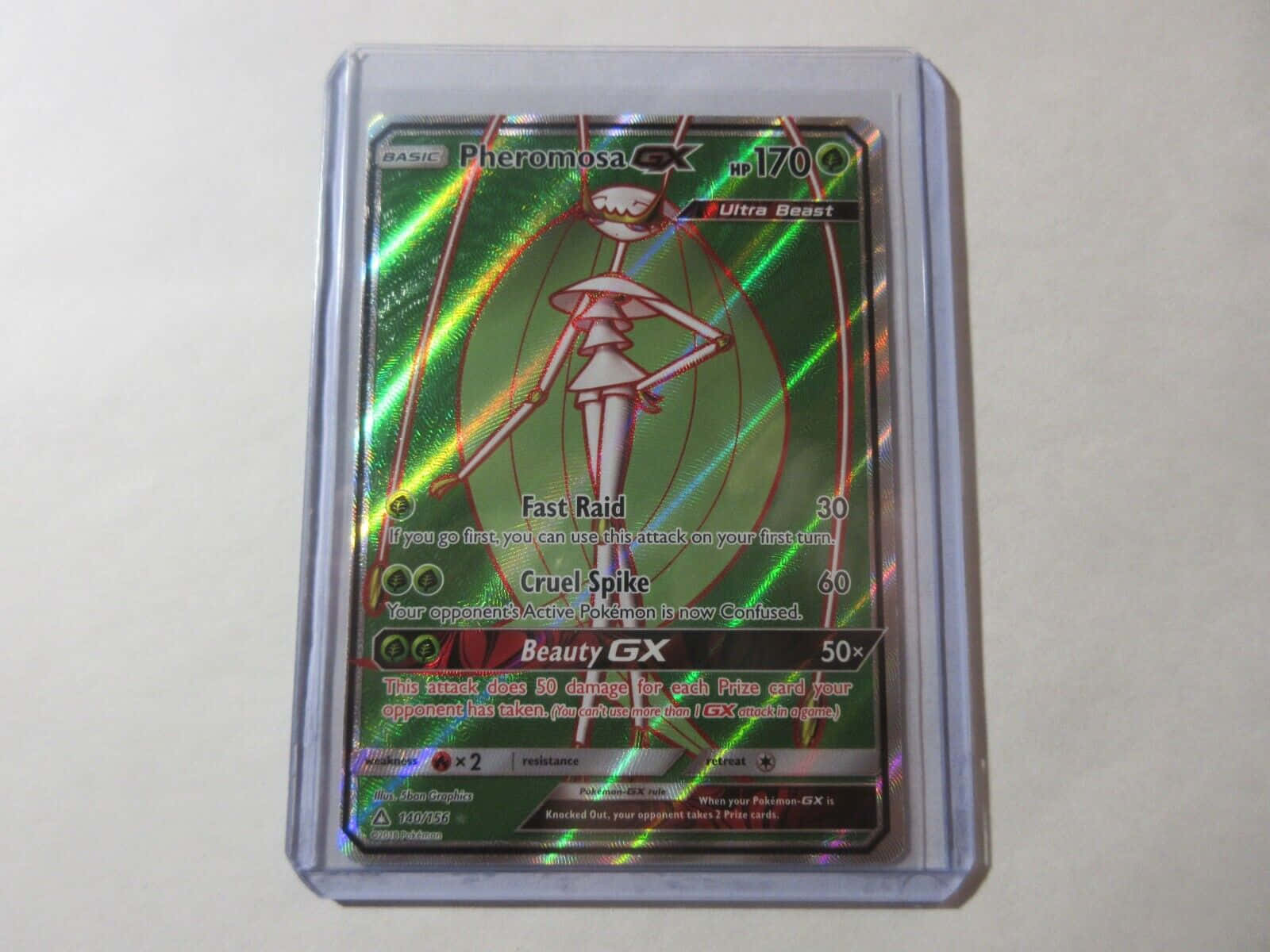Pheromosa Pokémon Trading Card Encased in a Clear Protective Sleeve Wallpaper