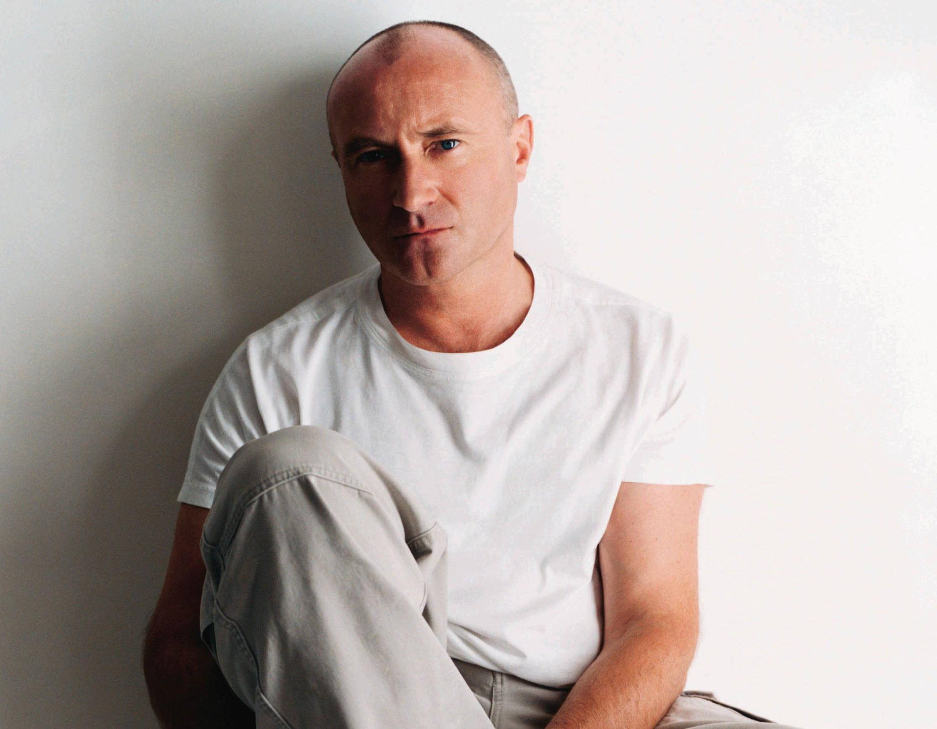 Phil Collins In White Shirt Wallpaper