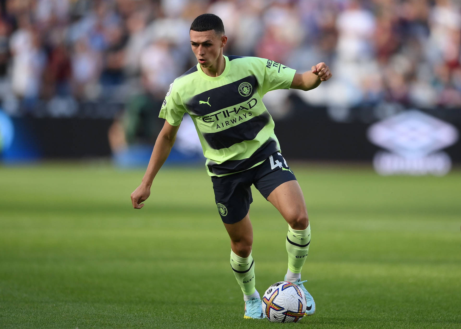 Phil Foden In Yellow-Green Jersey Wallpaper