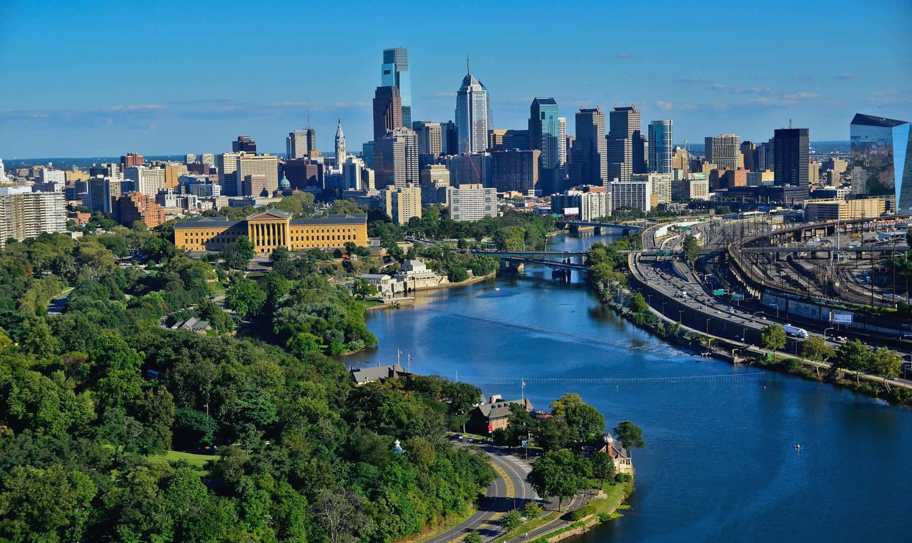 Philadelphia Skyline With Blue River Lake Wallpaper
