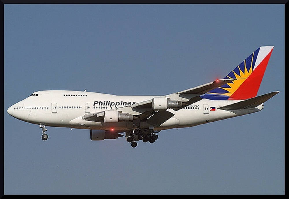 Philippine Airlines Flying Airplane In Dark Sky Wallpaper