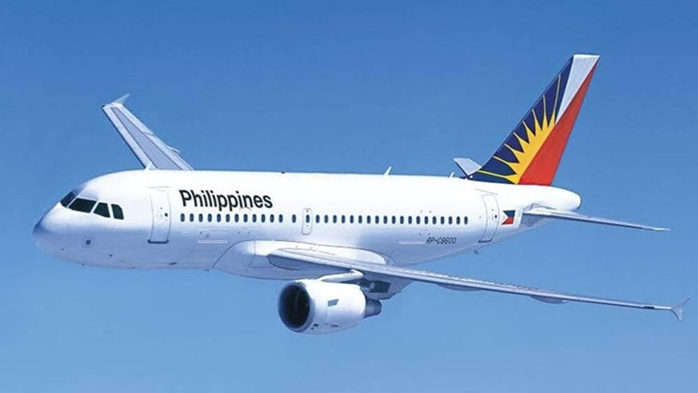 Philippine Airlines Flyver Hvid Fly på Solnedgangs Baggrund Wallpaper
