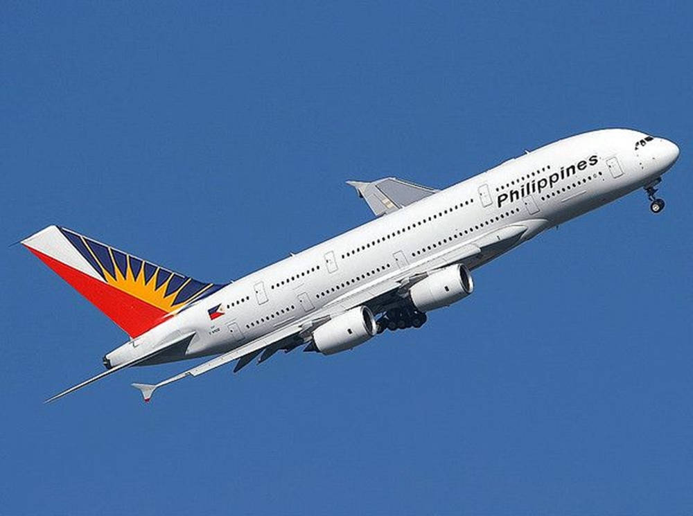 Philippine Airlines Plane In Clear Blue Sky Wallpaper