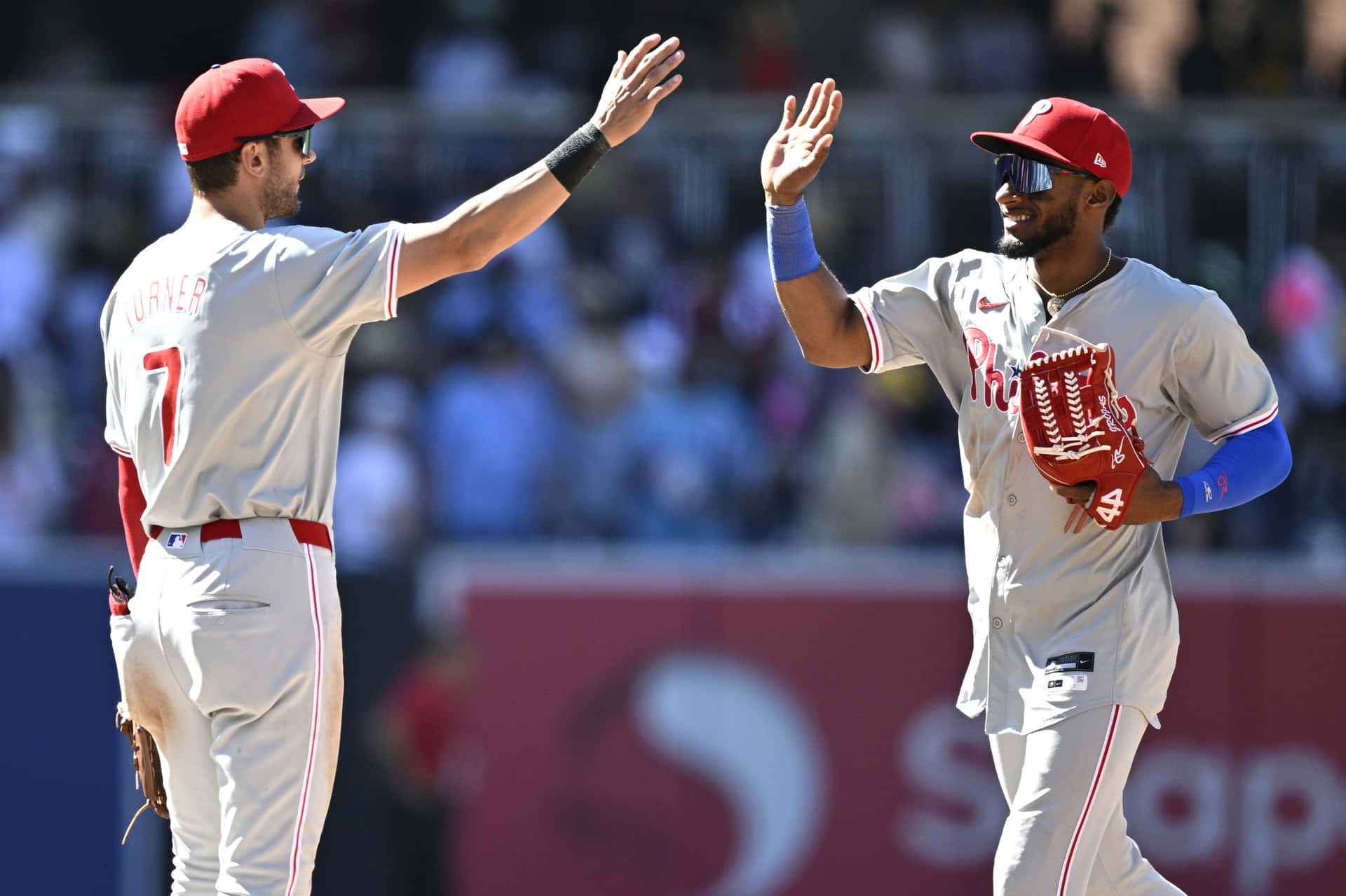 Download Phillies Players Celebrating On Field Wallpaper | Wallpapers.com