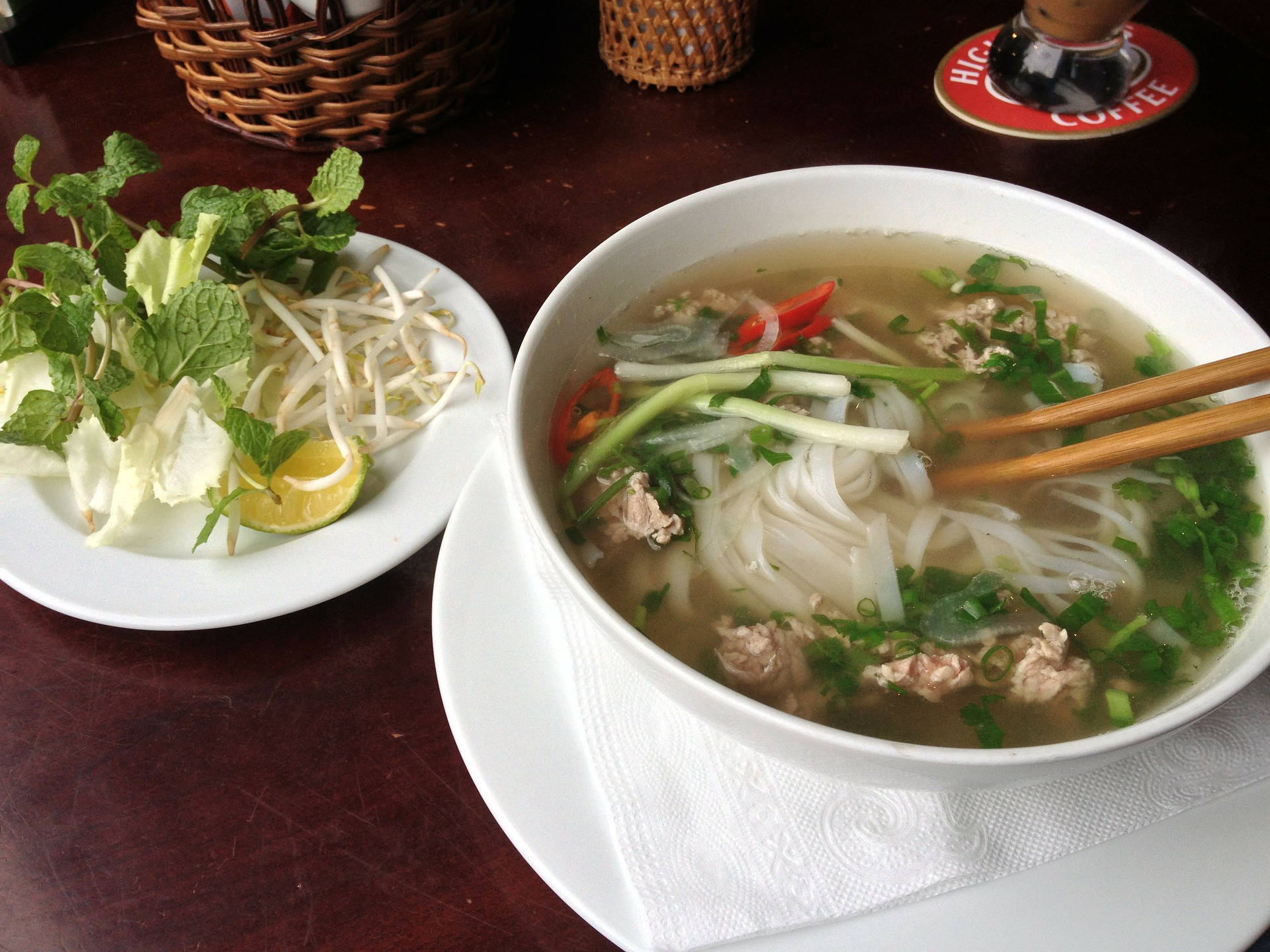 Warm bowl of traditional Vietnamese Pho with rice noodles. Wallpaper