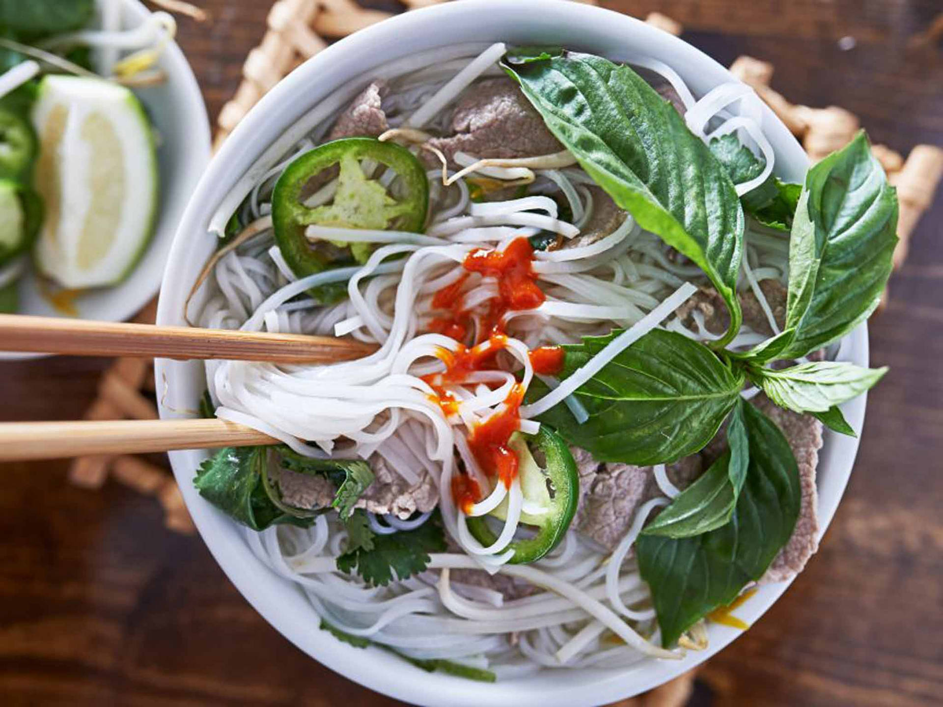 Authentic Vietnamese Pho with White Rice Noodles Wallpaper