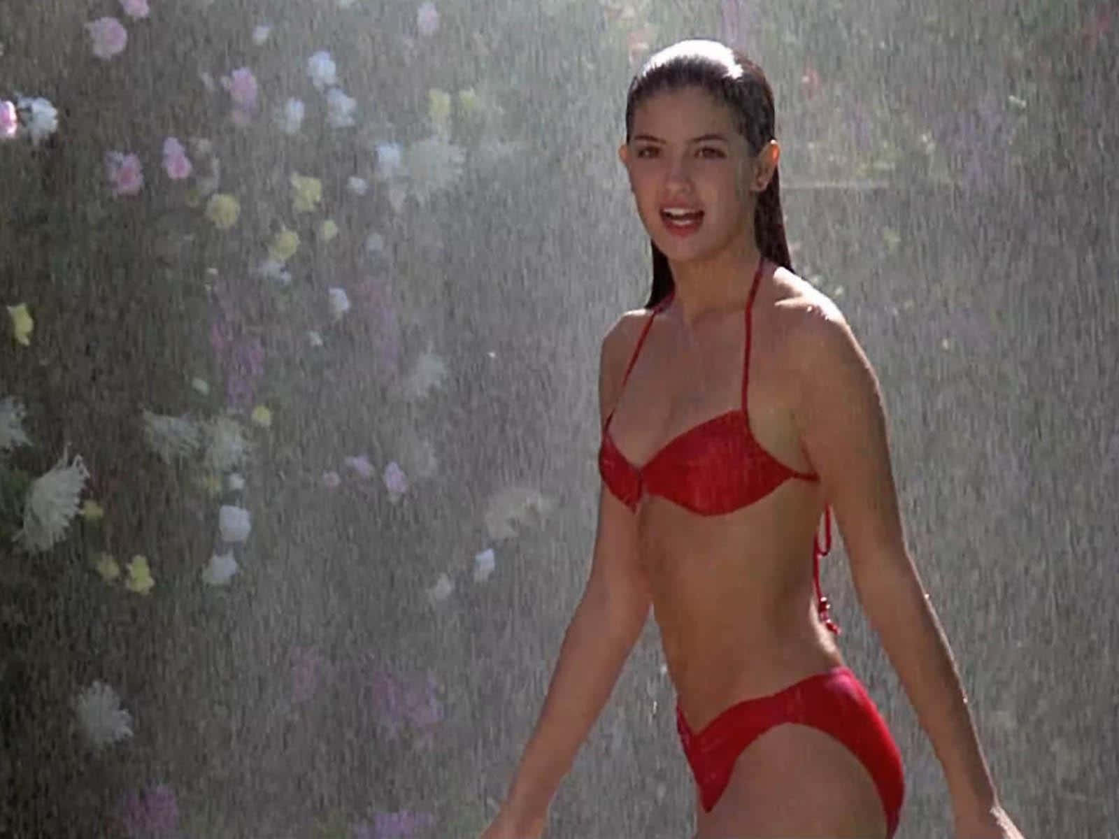 Phoebe Cates enjoys a moment of leisure during an outdoor photoshoot. Wallpaper