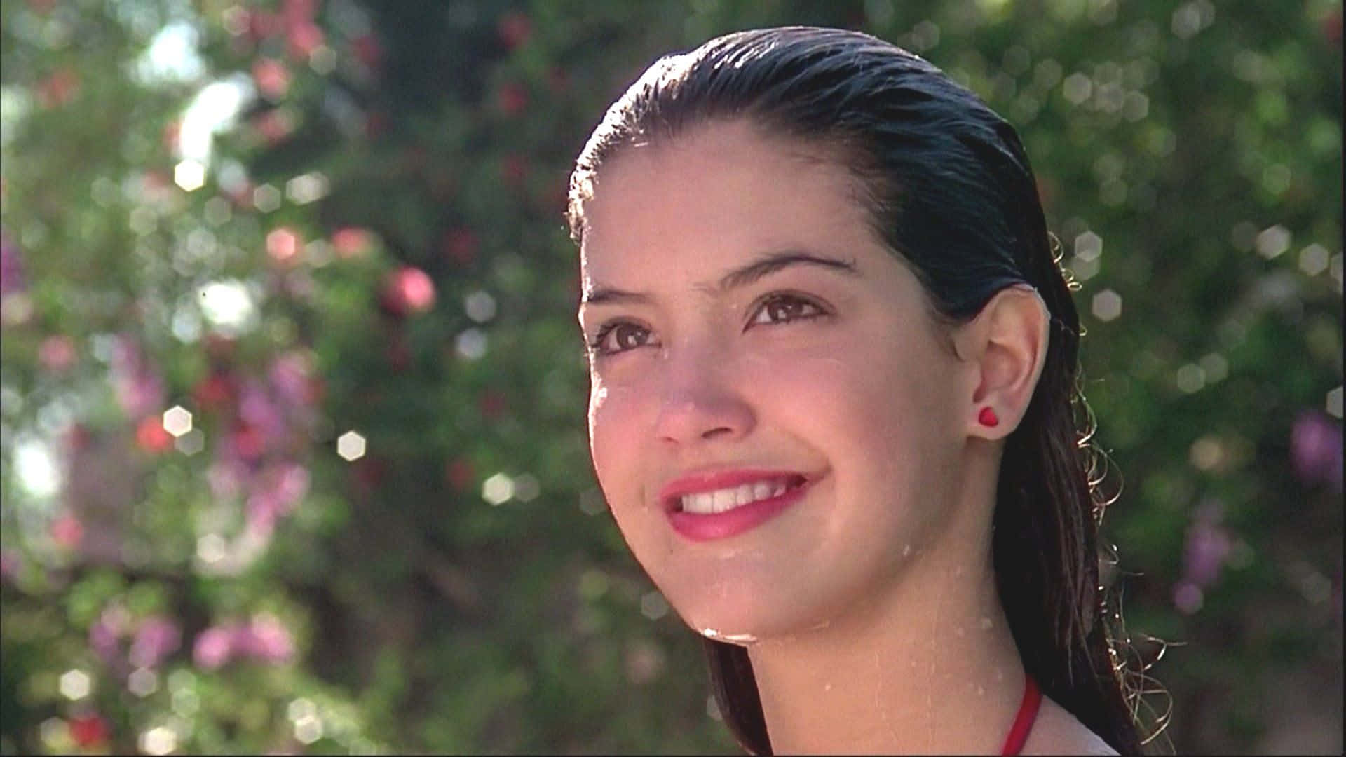 Phoebe Cates Smiling in a Classic Red Dress Wallpaper