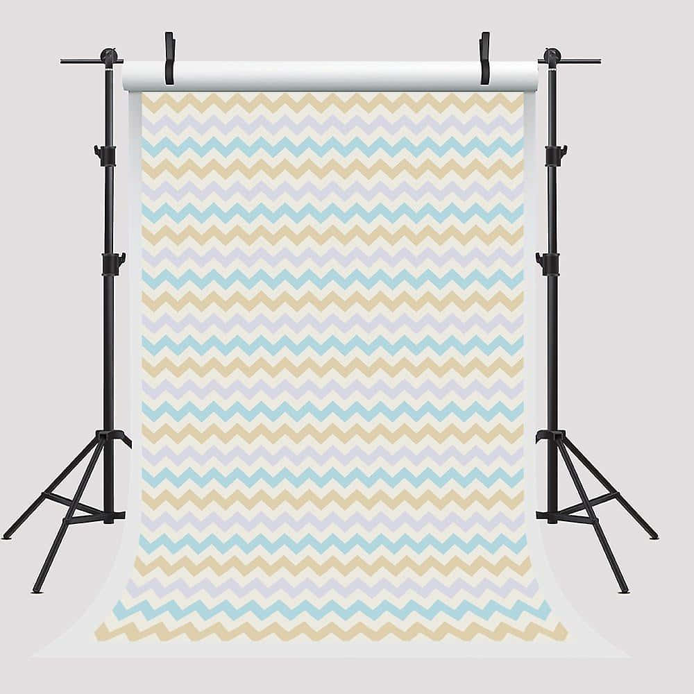A Chevron Backdrop With A Tripod And Stands