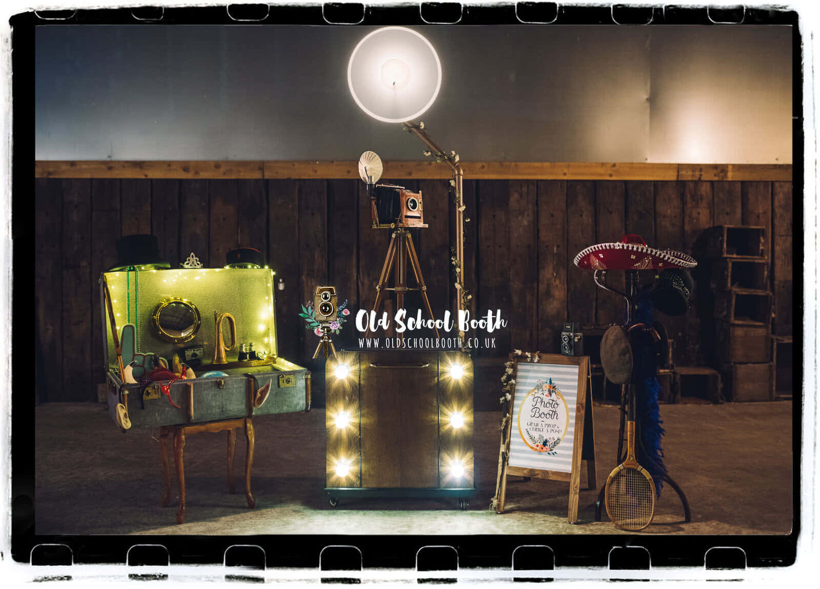 A Photo Booth With Lights And A Lamp