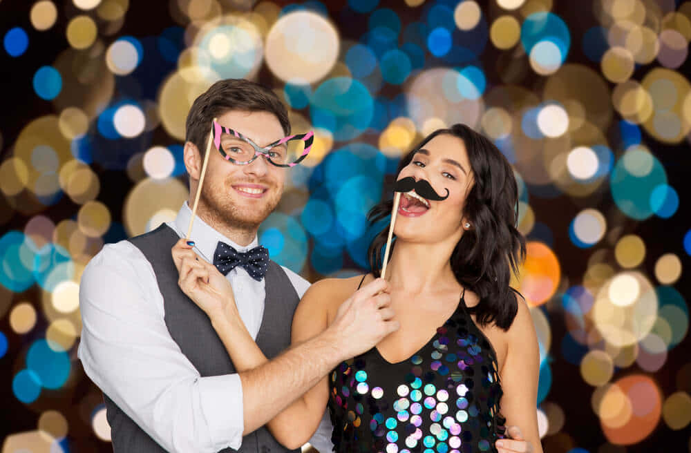 Friends capture a moment of fun in a photobooth!