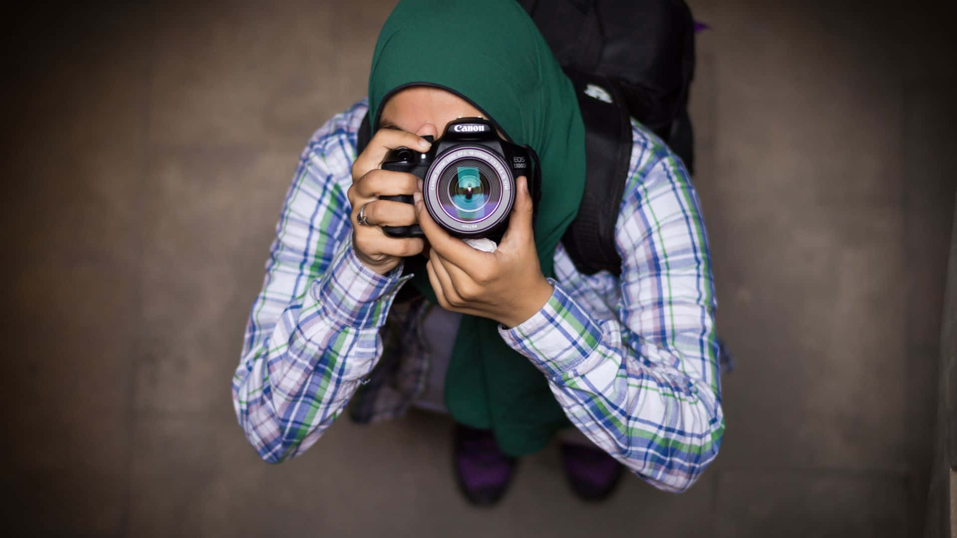 A Woman Taking A Picture With Her Camera