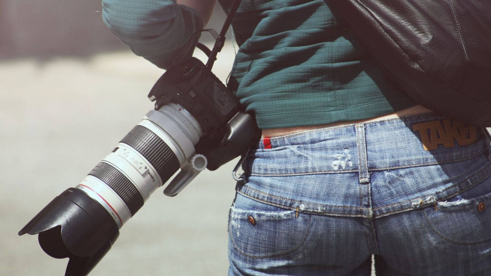 Photographer Carrying A Camera Wallpaper