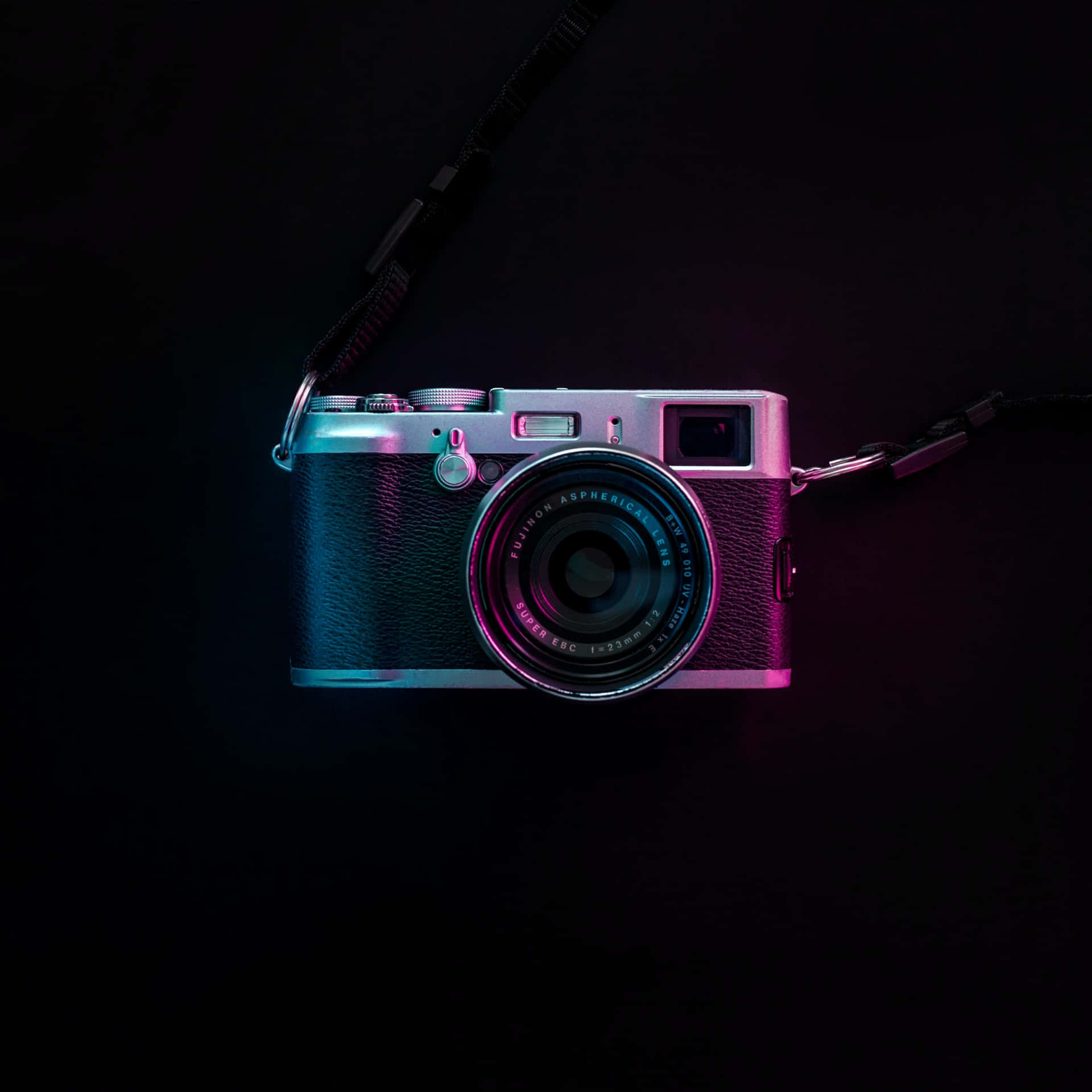 Magnificent Photography Camera Illuminated by Enchanting Purple Light Wallpaper