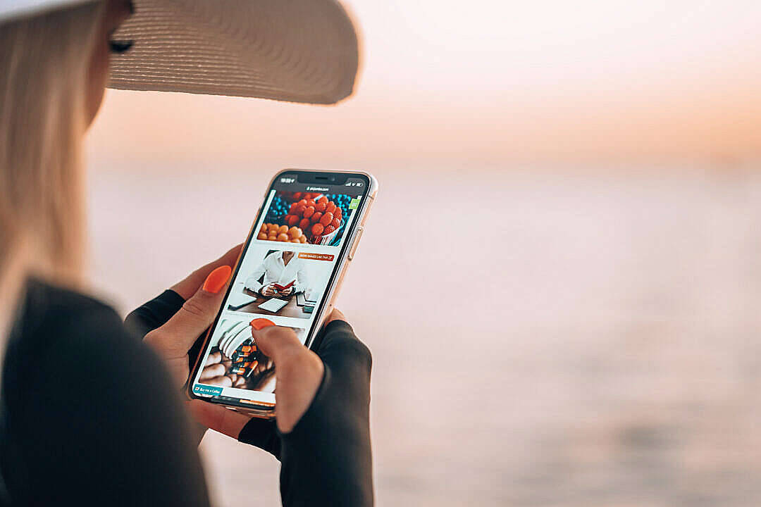 Photography Of Hat Woman Using Iphone Wallpaper