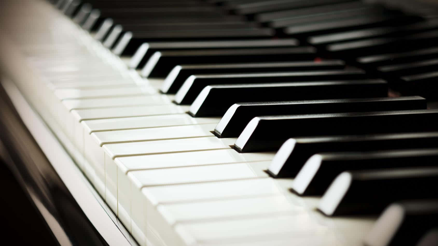 A Close Up Of A Piano Keyboard