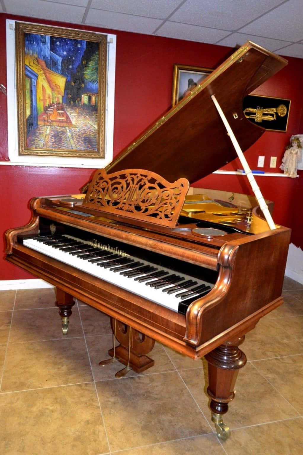 a grand piano in a room with a painting